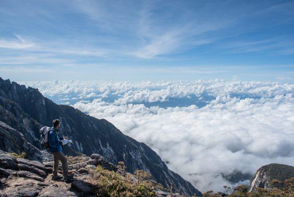 climber looking scenic view with cloud on mount kinabalu sabah malaysia
