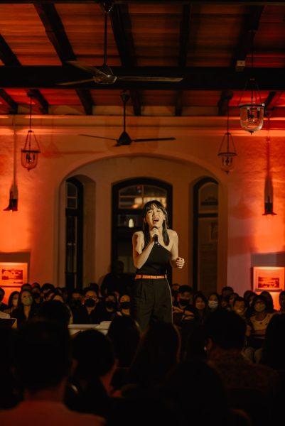 girl singing on stage performance