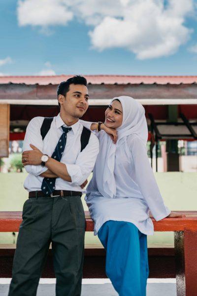 high school couple sitting bench
